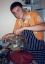 CLICK FOR FULLSIZE IMAGE Nick prepares curry for many 