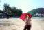 CLICK FOR FULLSIZE IMAGE Protecting myself from the heat on the beautiful beach at Chumporn, on Thailand's east coast 