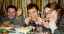 CLICK FOR FULLSIZE IMAGE The feast continues -- chicken claws!   (Can you see fear in Michelle's eyes?) 