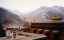 CLICK FOR FULLSIZE IMAGE Looking across lamasery buildings to snowy hillsides 
