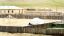 CLICK FOR FULLSIZE IMAGE Lhagva turns up the 'skirt' of the ger - it's a warm day 